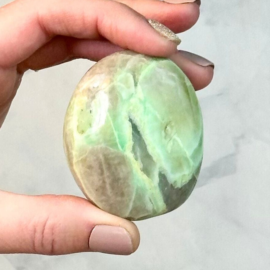 One (1) Green Moonstone Palm Stone