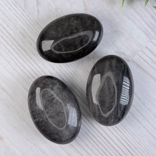 One (1) Silver Sheen Obsidian Palm Stone
