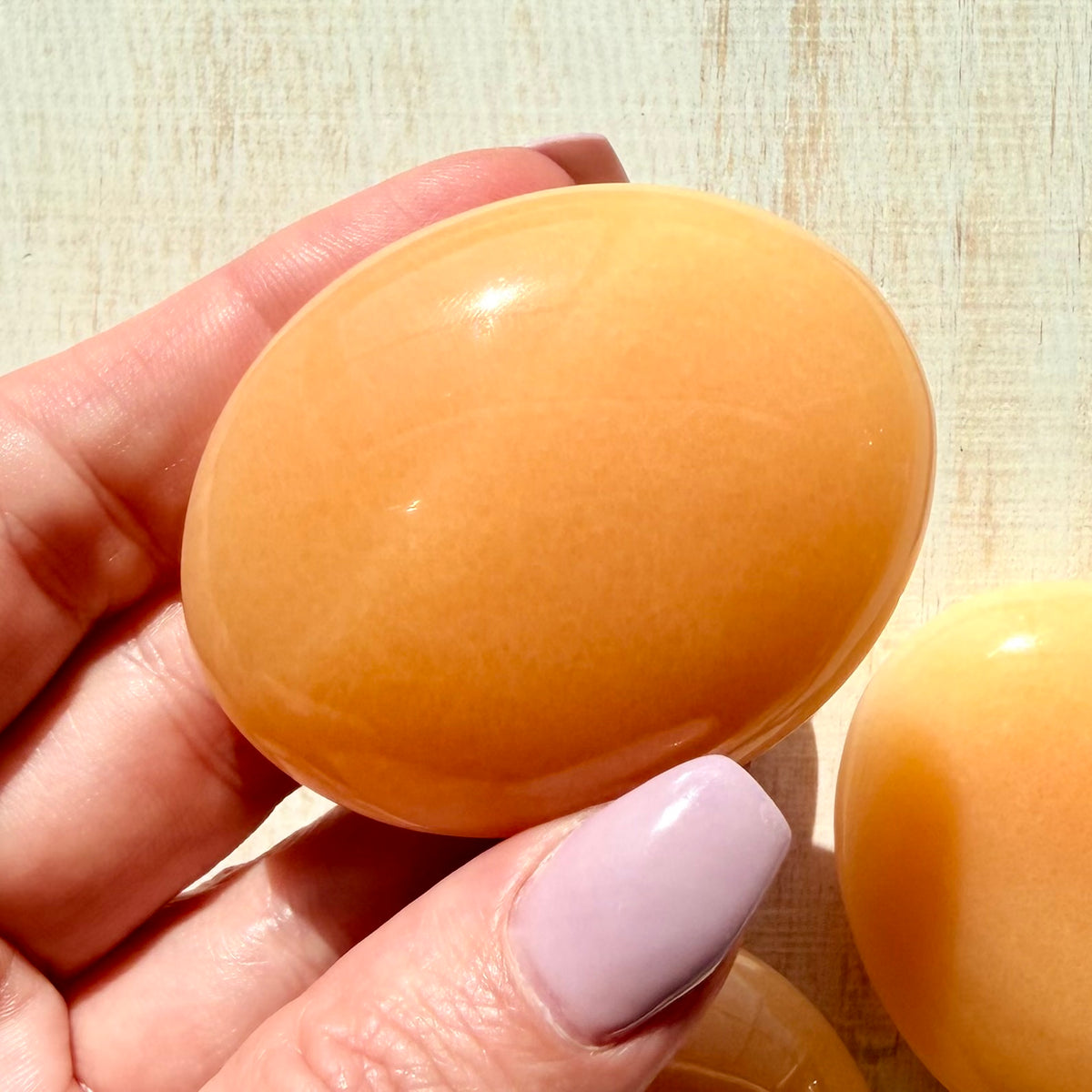 Orange Calcite Palm Stone – Vibrant Crystal for Energy & Creativity