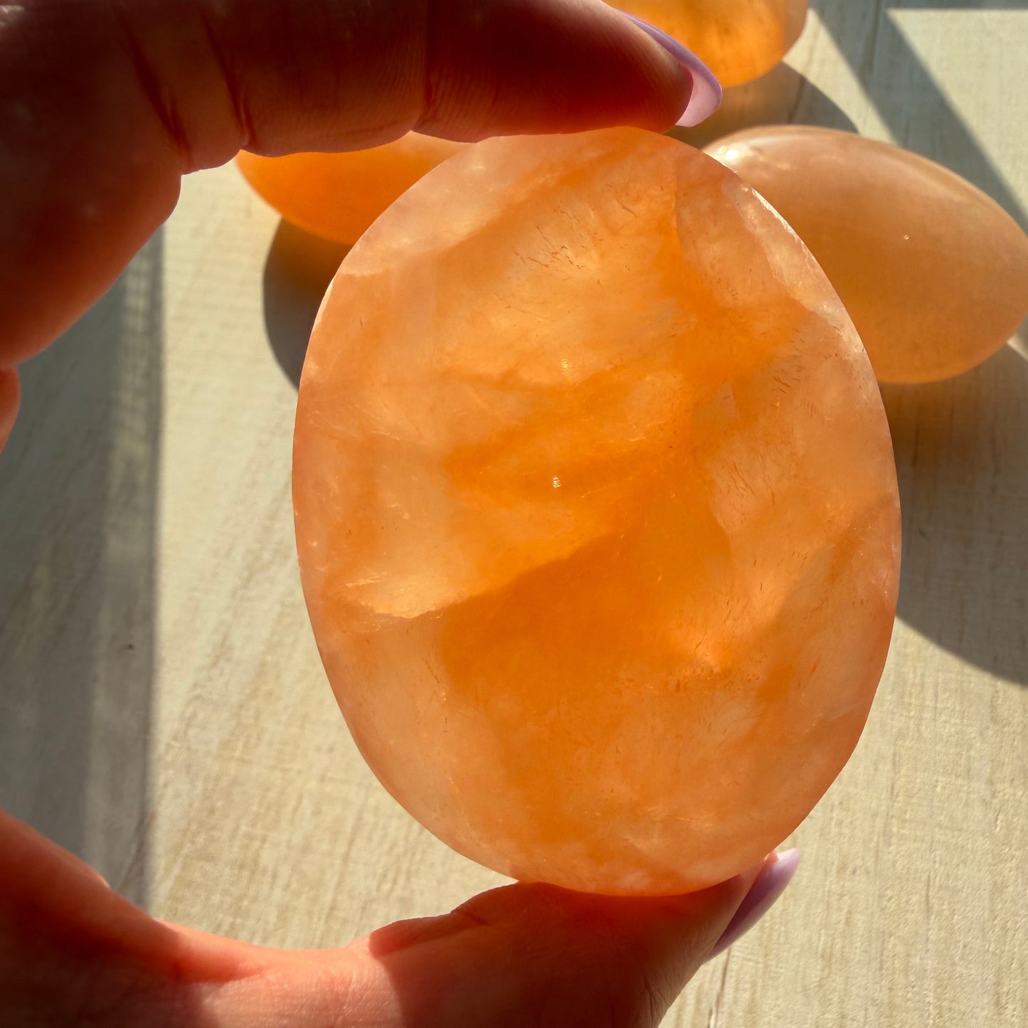 One (1) Large Peach Selenite Palm Stone from Morocco (~7.5cm)
