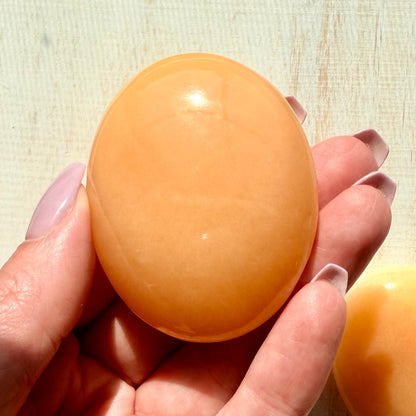 Orange Calcite Palm Stone – Vibrant Crystal for Energy & Creativity