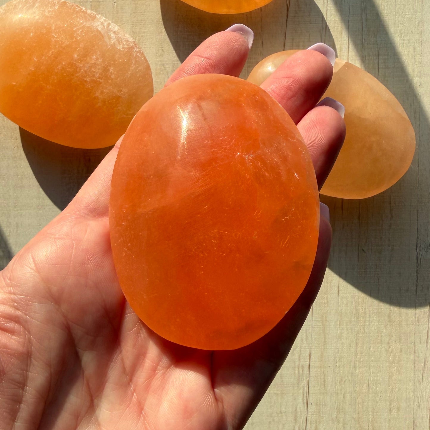 One (1) Large Peach Selenite Palm Stone from Morocco (~7.5cm)