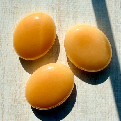 Orange Calcite Palm Stone – Vibrant Crystal for Energy & Creativity