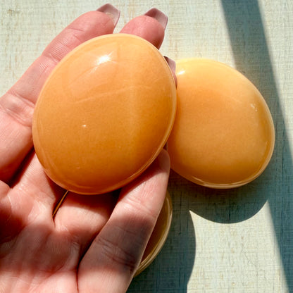Orange Calcite Palm Stone – Vibrant Crystal for Energy & Creativity