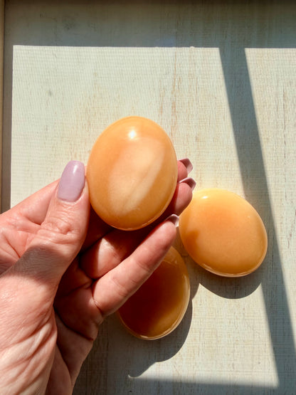 Orange Calcite Palm Stone – Vibrant Crystal for Energy & Creativity