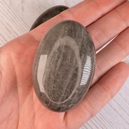 One (1) Silver Sheen Obsidian Palm Stone