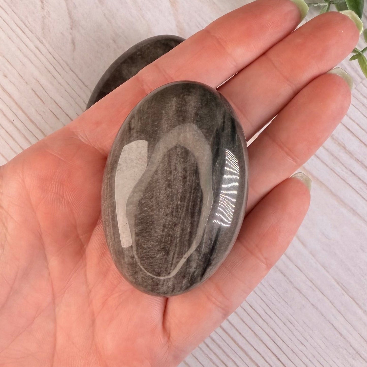 One (1) Silver Sheen Obsidian Palm Stone