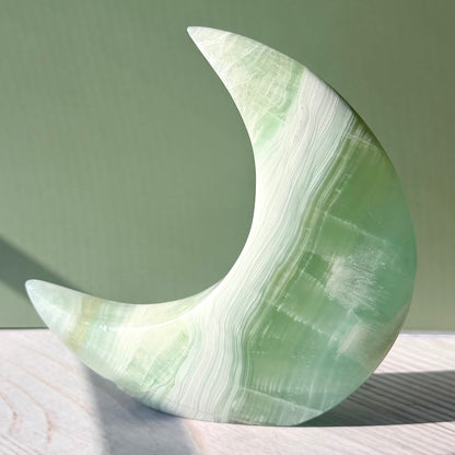 Pistachio Calcite Crescent Moon Carving – Soft Green Crystal for Peace