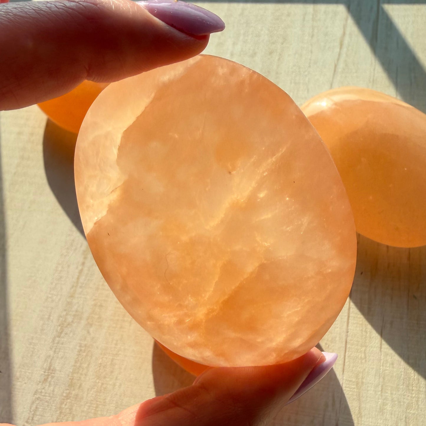 One (1) Large Peach Selenite Palm Stone from Morocco (~7.5cm)
