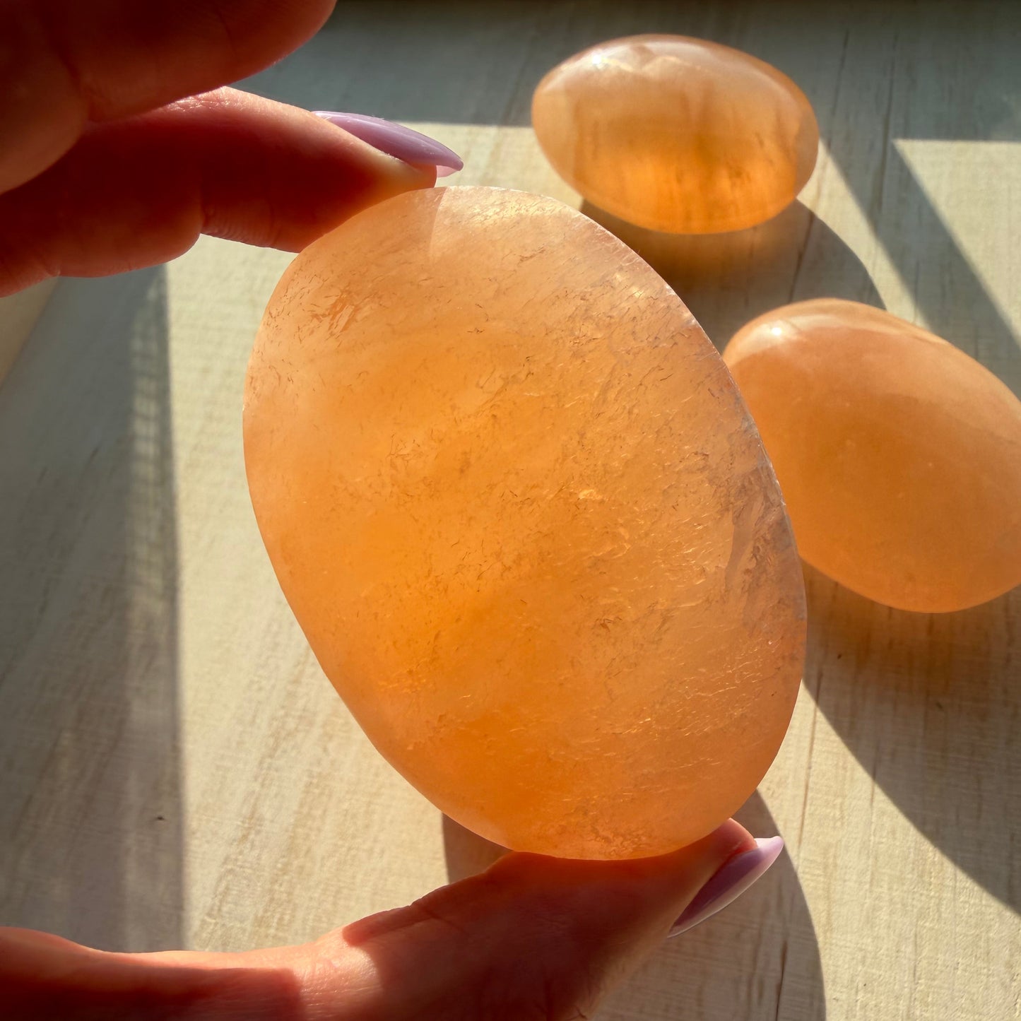One (1) Large Peach Selenite Palm Stone from Morocco (~7.5cm)