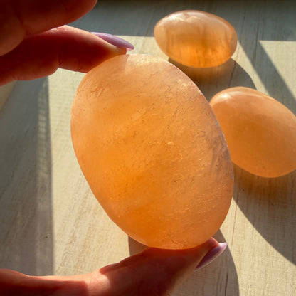 One (1) Large Peach Selenite Palm Stone from Morocco (~7.5cm)