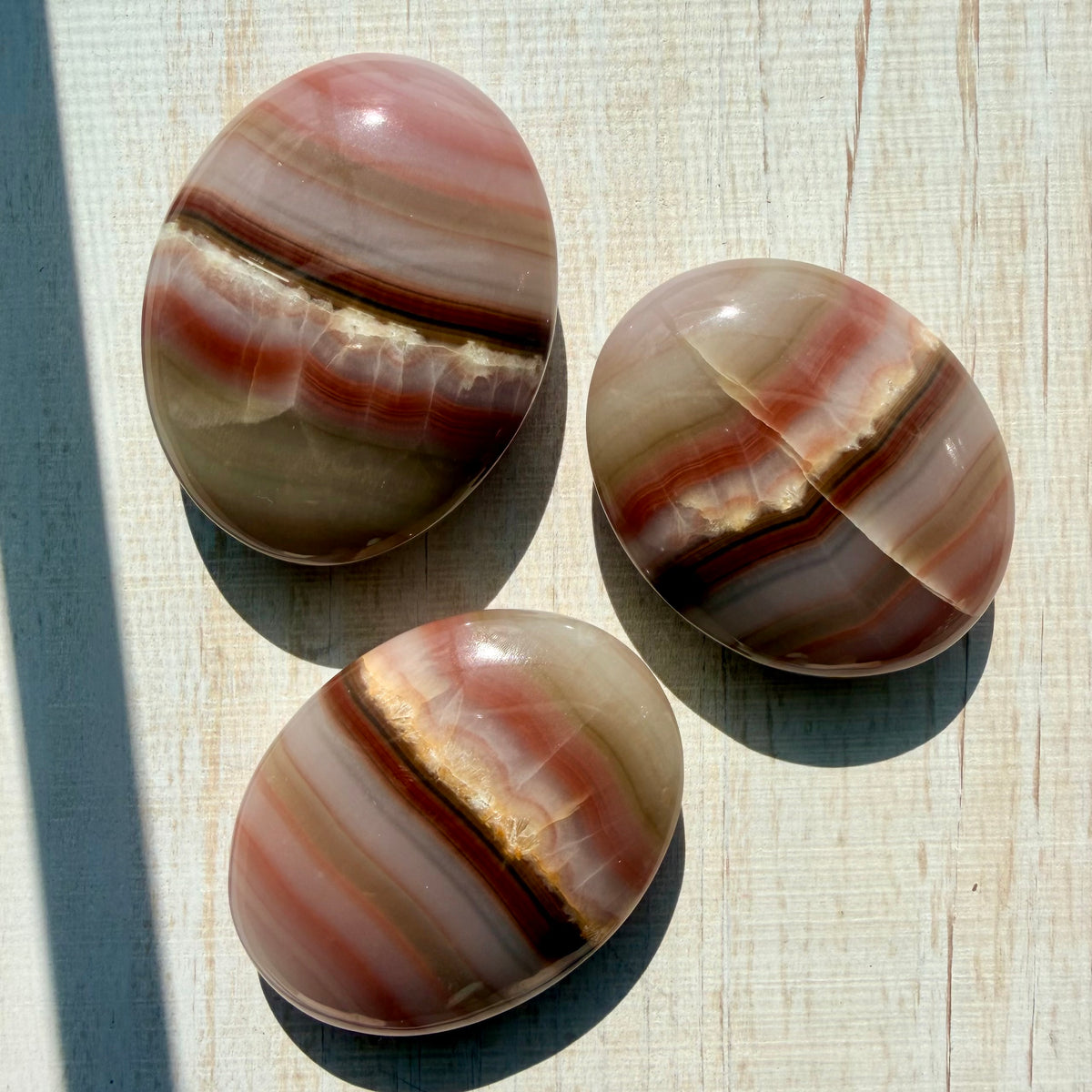 Neapolitan Banded Calcite Palm Stone – Warm Caramel Crystal for Calm