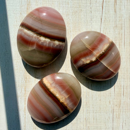 Neapolitan Banded Calcite Palm Stone – Warm Caramel Crystal for Calm