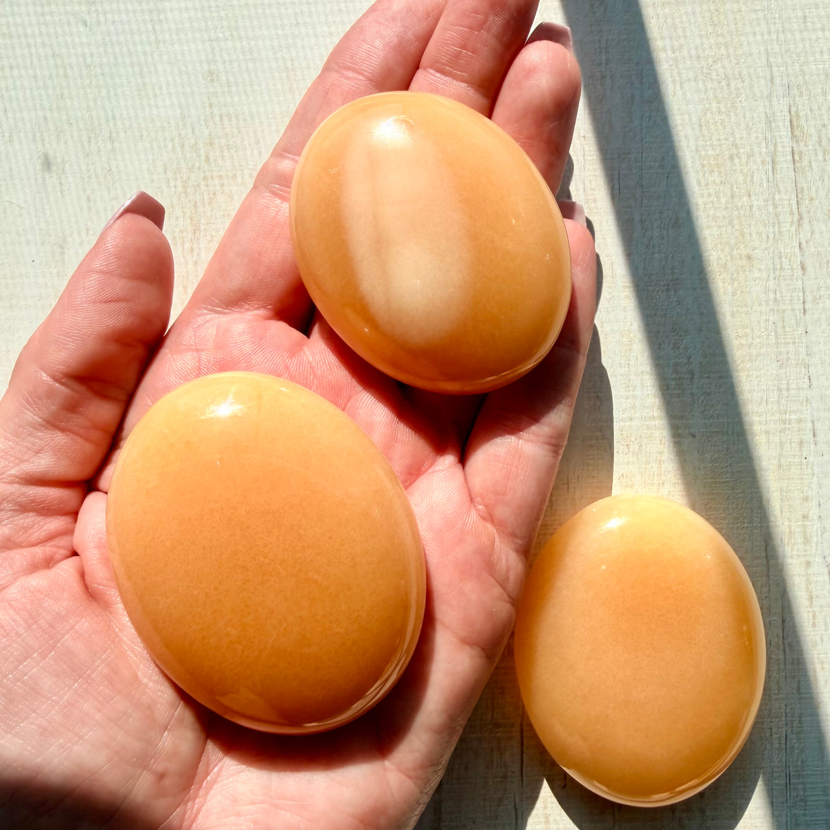 Orange Calcite Palm Stone – Vibrant Crystal for Energy & Creativity