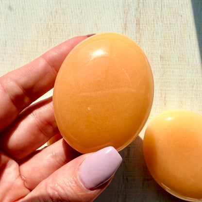 Orange Calcite Palm Stone – Vibrant Crystal for Energy & Creativity