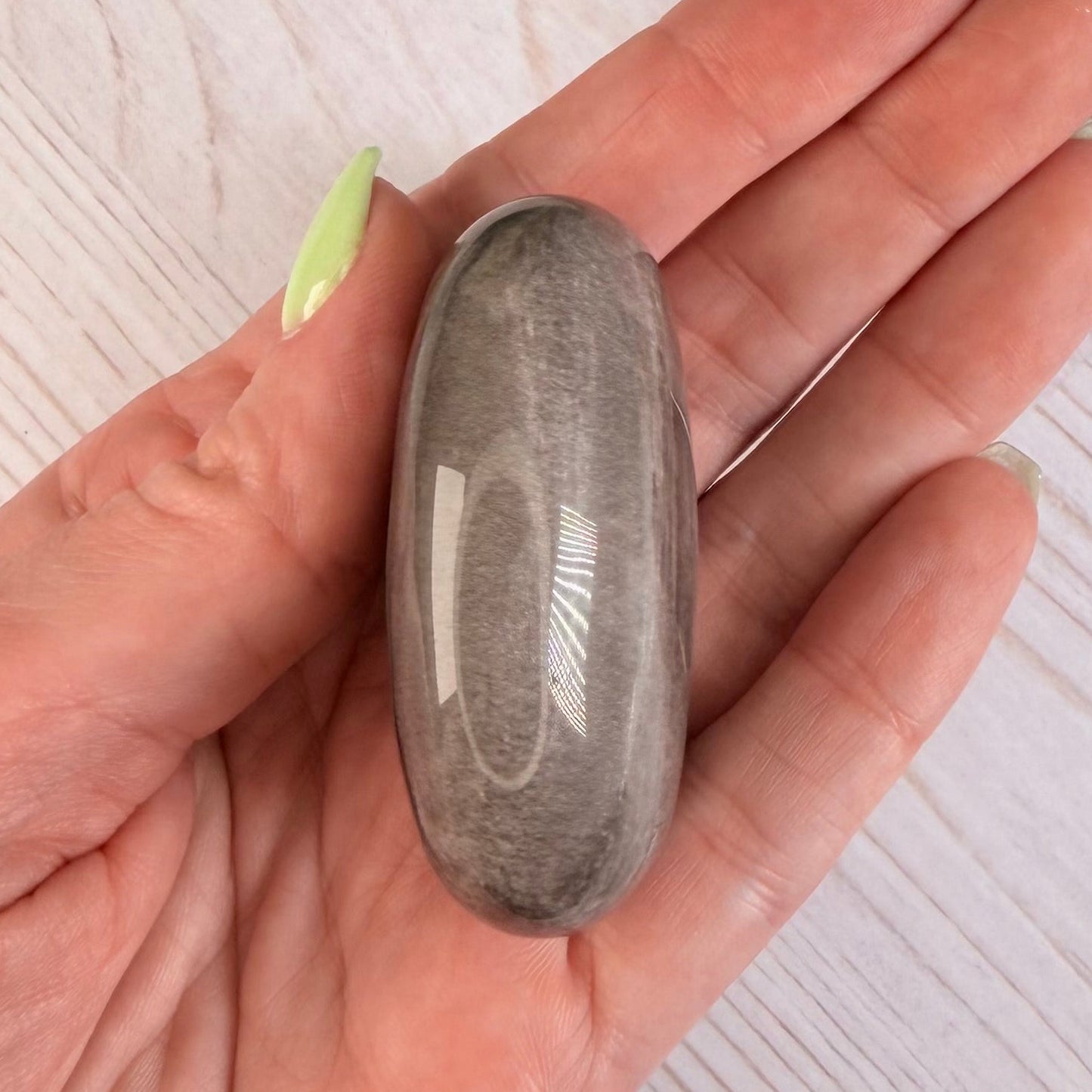 One (1) Silver Sheen Obsidian Palm Stone