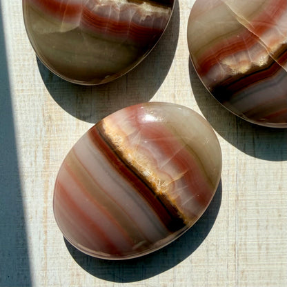 Neapolitan Banded Calcite Palm Stone – Warm Caramel Crystal for Calm