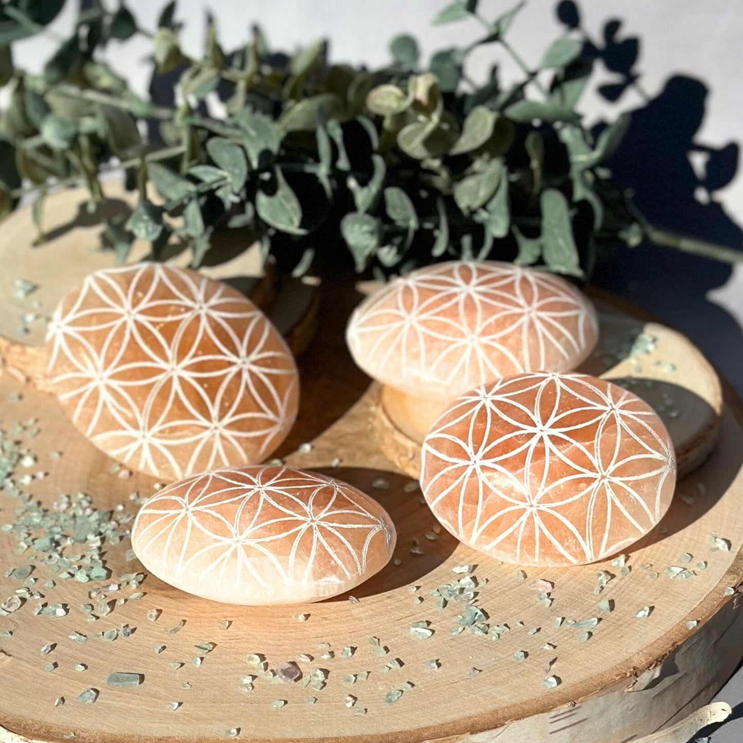 orange selenite palm stones flower of life