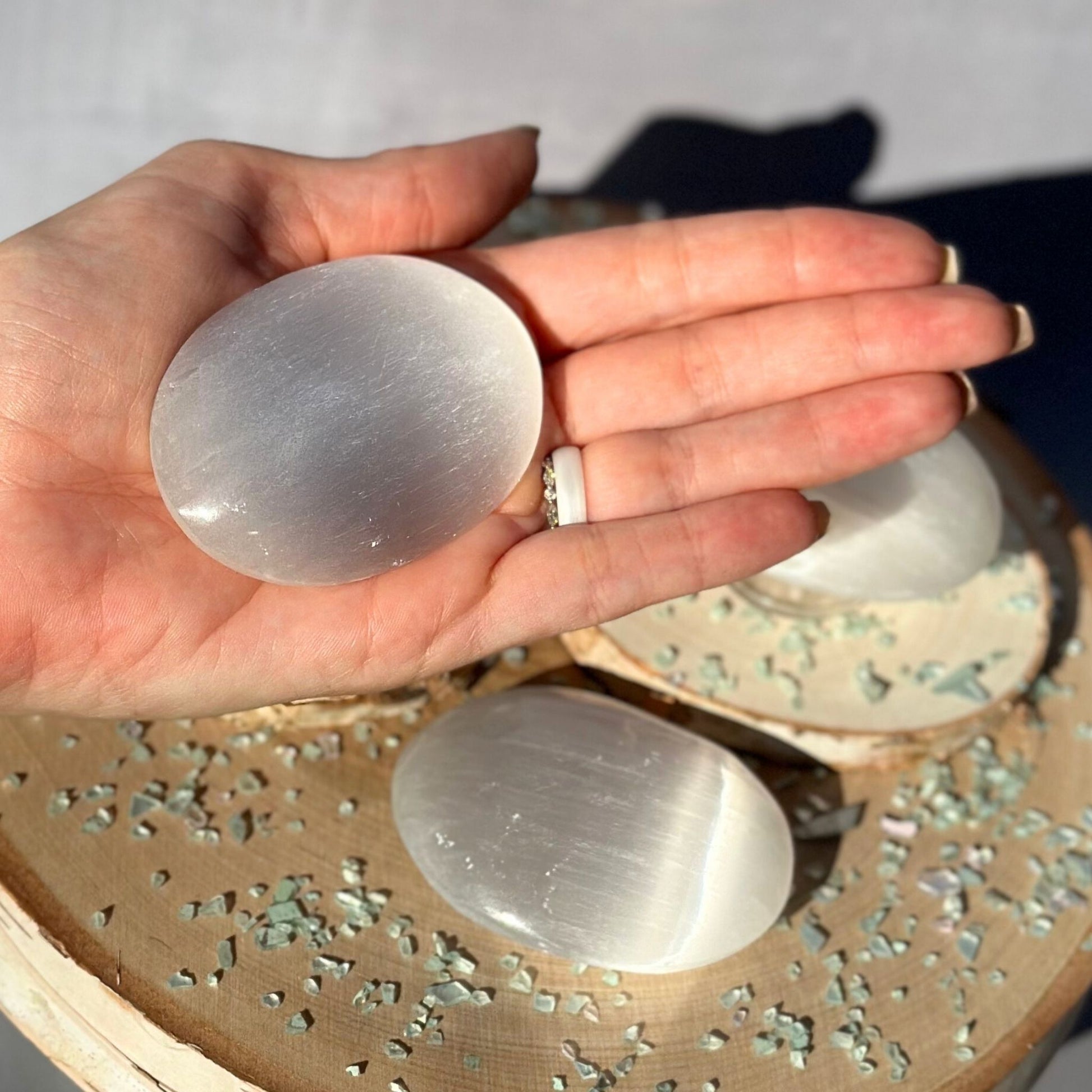 selenite palm stones